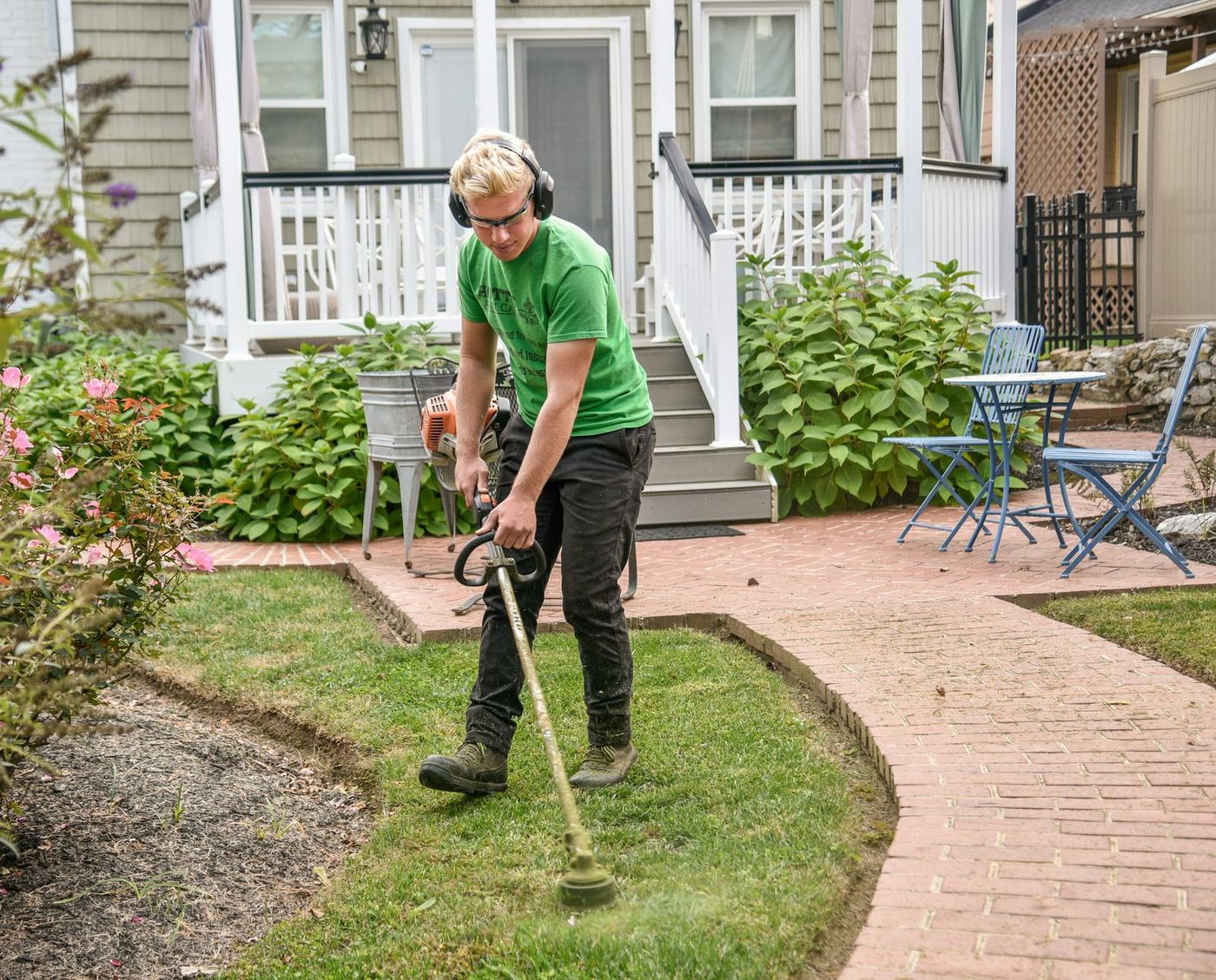 NS Outdoors crew edge-trimming a residential lawn
